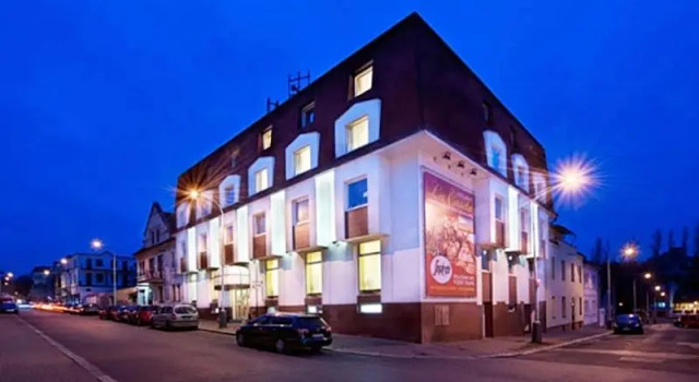 Łóżko w pokoju wieloosobowym Hotel Henrietta
