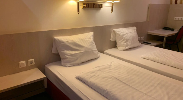 Кровать в общем номере Hotel New Fair Munich Messe