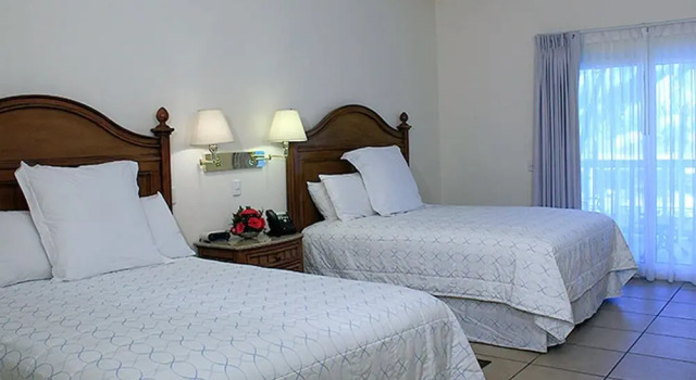 Standard quadruple chambre Vue piscine Telamar Resort
