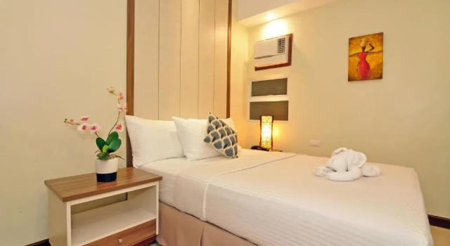 Standardowy czteroosobowy pokój Belian Hotel