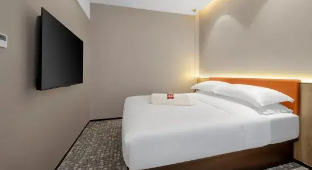 Семейный люкс GINLAN JIA Chongwen Impression Hotel (Nantong University Town Yuanyong Plaza)