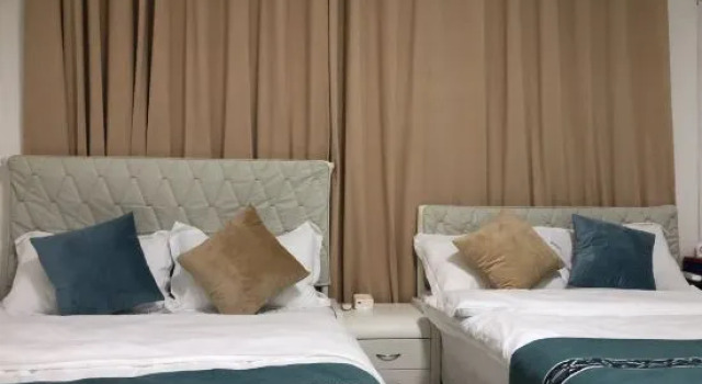 Кровать в общем номере Qi Shan Hai B&B