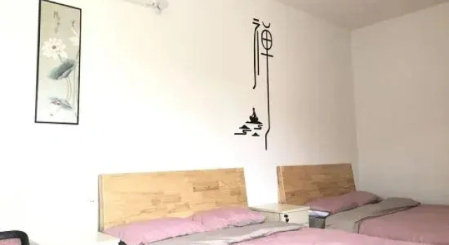 Кровать в общем номере The House B&B