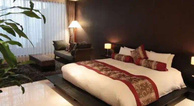 Кровать в общем номере Kizashi The Suite Kyoto Gion
