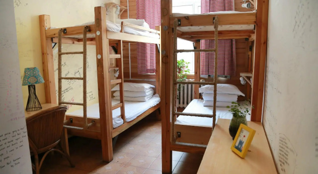 Кровать в общем номере Harbin North International Youth Hostel