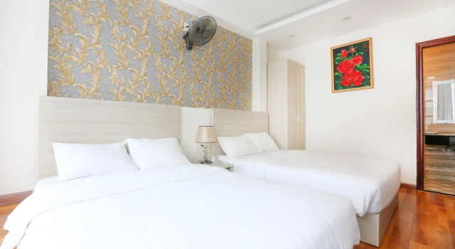 Четырёхместный номер Deluxe TTR Vincent Hotel