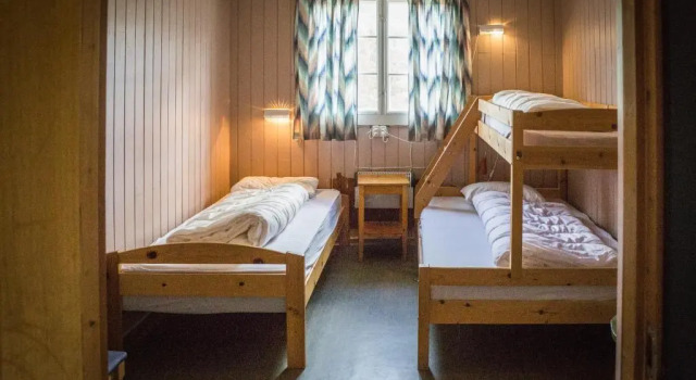 Кровать в общем номере Rondane Fjellstue