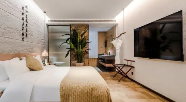 Кровать в общем номере Floral Hotel·Moye Moonlight Hot Spring Hotel