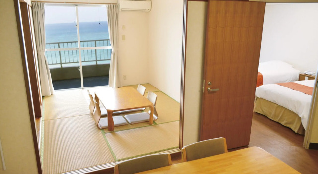 Кровать в общем номере TWIN LINE HOTEL YANBARU OKINAWA JAPAN Formerly Okinawa Suncoast Hotel