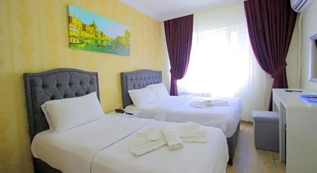 Standardowy trzyosobowy pokój Grand FM Hotel
