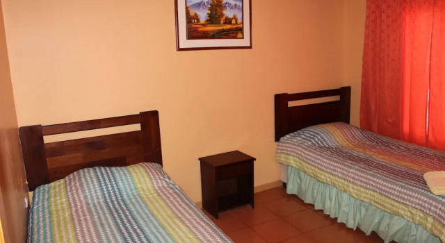 Кровать в общем номере Hostal Atacama North