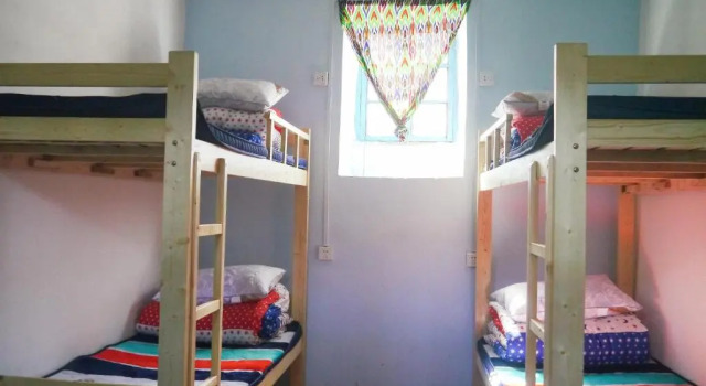 Кровать в общем номере Turpan Dap Youth Hostel