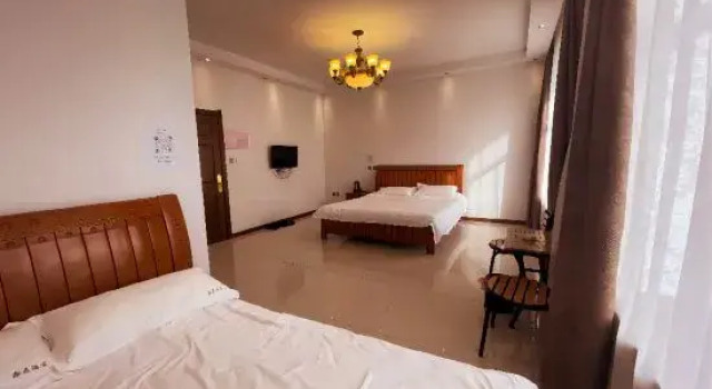Кровать в общем номере Yabuli Qingyun County Xin Ding Apartment Hotel