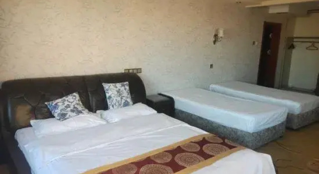 Кровать в общем номере Harbin Jinjing Mansion Hotel (Acheng Passenger Transport Terminal)