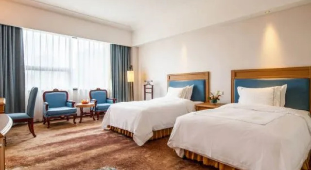 Семейный люкс Executive Huaxin Teckon Xiyue Hotel (Ningbo Fenghua Wanda Plaza Fenghua Intime City)