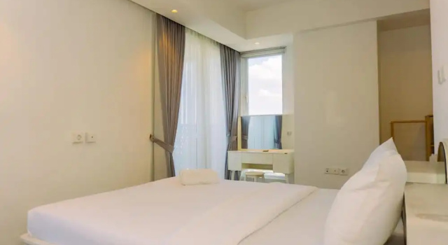 Апартаменты Deluxe Spacious 1BR with Japandi Design at West Vista Apartment By Travelio