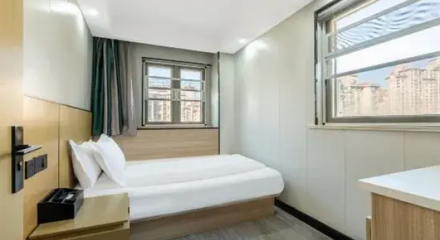 Люкс Xinshang Cinema Hotel (Yancheng Zhongnan City University Town Branch)