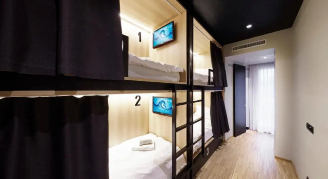 Кровать в общем номере Hotel Aqua