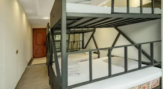 Кровать в общем номере Shang 9 Hotel (Emei High-Speed Railway Station Dafo Chan Temple Tourism Area)