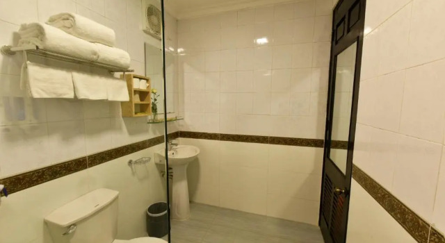 Кровать в общем номере Group Nest Hotel