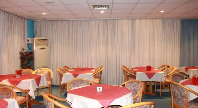 Кровать в общем номере The Caravel Hotel