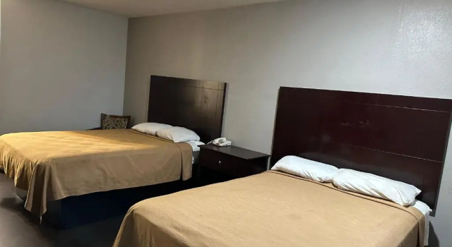 Четырёхместный номер Standard DELUXE INN augusta