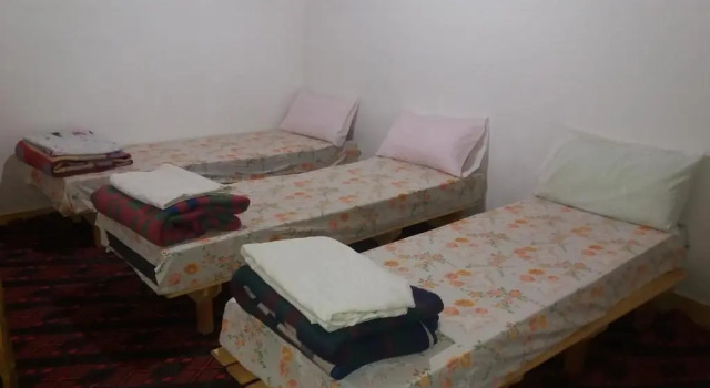 Кровать в общем номере Gîte Assafar