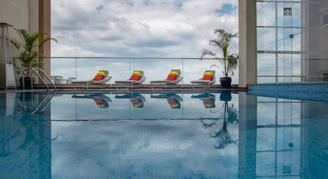 Кровать в общем номере Мансарда The Concord Hotel & Suites