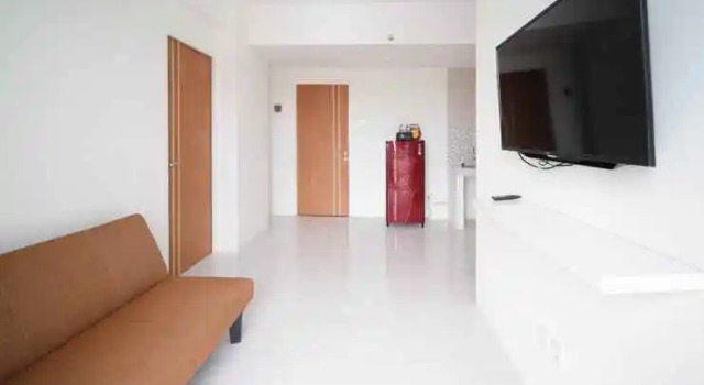 Tidy and Best Choice 2BR at Puncak Dharmahusada Apartment By Travelio