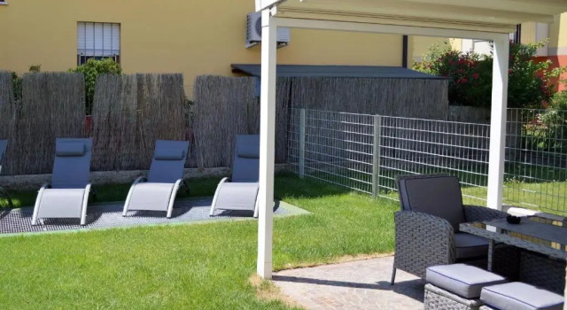 Апартаменты Appartamento Campagnola con giardino privato e due camere da letto