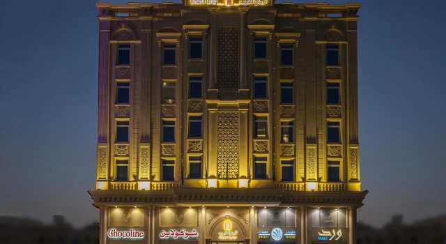 Кровать в общем номере Western Lamar Hotel