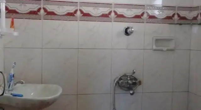 Кровать в общем номере с 6 комнатами Hotel Elite International Thrissur