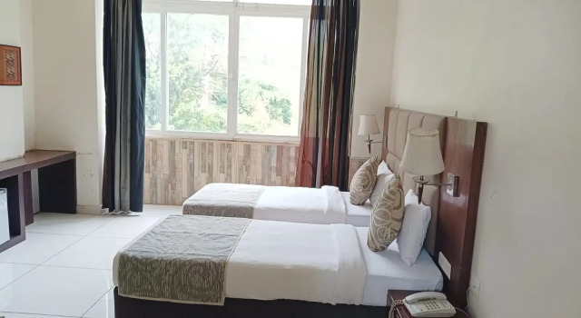 Кровать в общем номере Manuni Inn - Riverside Hotel
