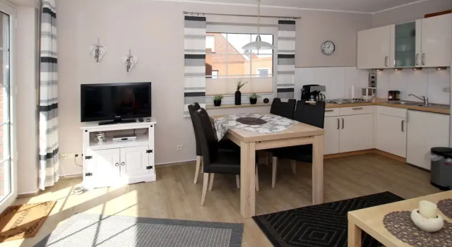 Апартаменты Ferienwohnung mit Sonnenterrasse in Dornumersiel