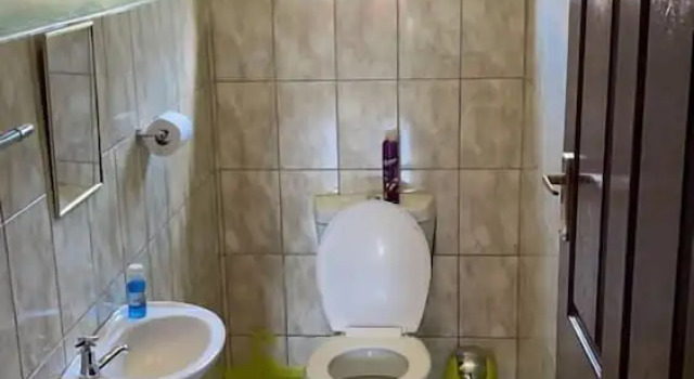 Кровать в общем номере Sweet Holiday Homes