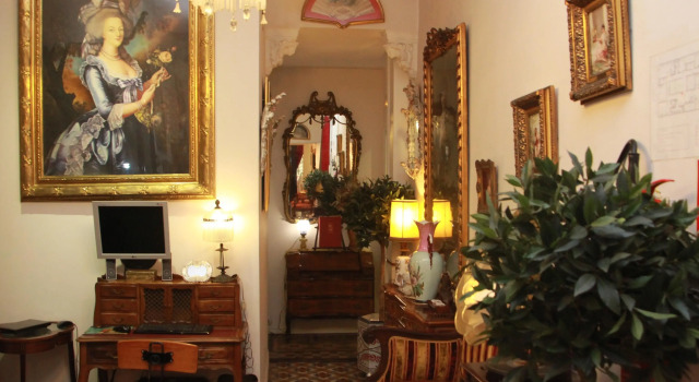 Кровать в общем номере BUHO Boutique Rooms