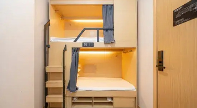 Кровать в общем номере Jiting Youth Hostel