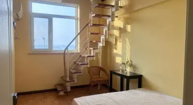Кровать в общем номере Дуплекс с видом на море Wafangdian Guanxinchao Hotel