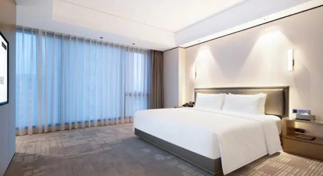 Трёхместный семейный люкс Jiashihao Hotel