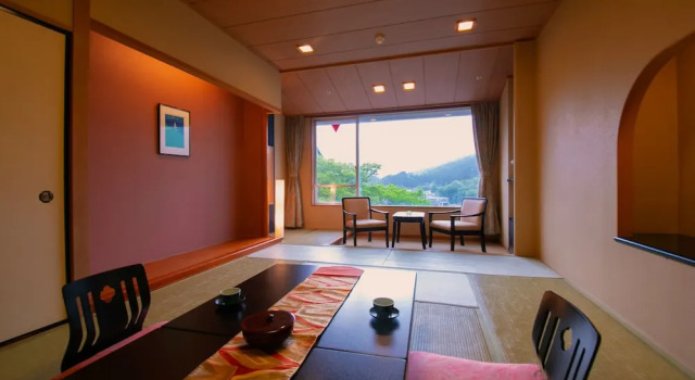 Кровать в общем номере Kesennuma Plaza Hotel