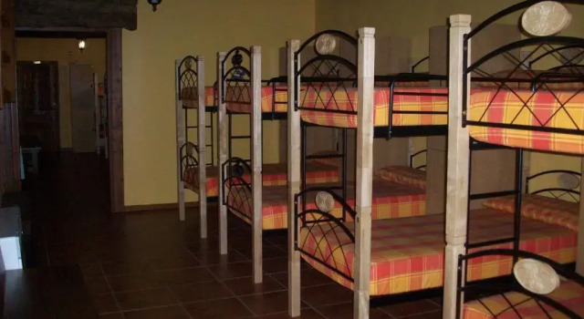 Кровать в общем номере Albergue Estrella Del Camino