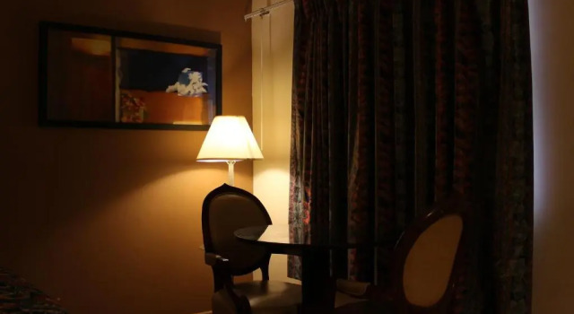 Четырёхместный номер Standard American Inn and Suites