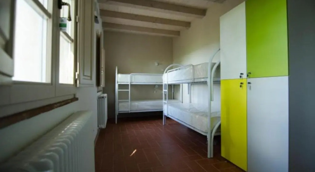 Кровать в общем номере Ostello San Miniato