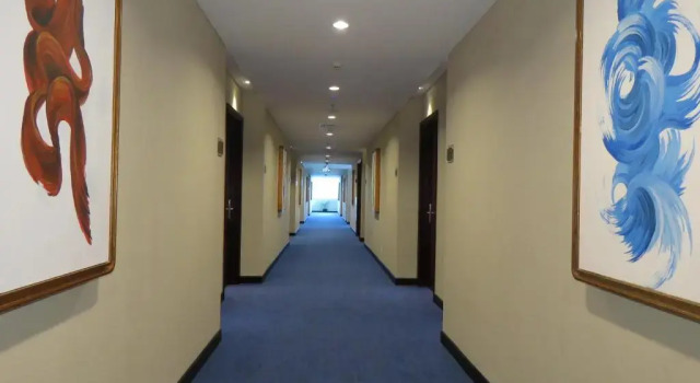 Кровать в общем номере dprimahotel Kualanamu Airport Medan