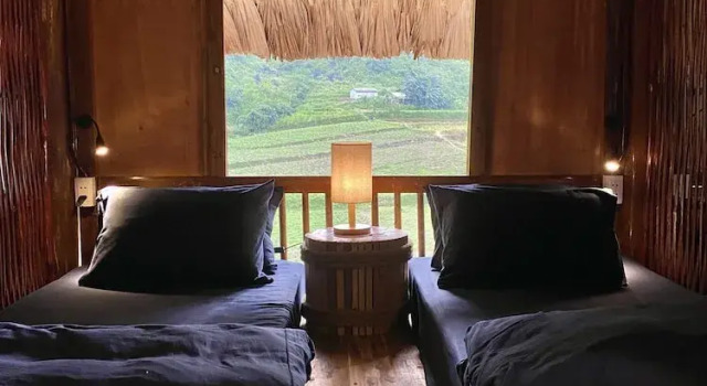 Кровать в общем номере Tớ Dày Du Già Village
