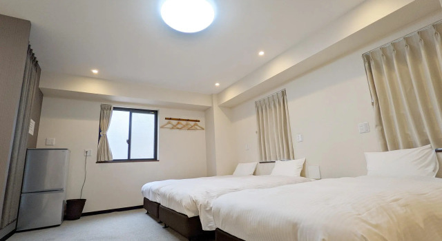 Кровать в общем номере KYU KYU HOTEL