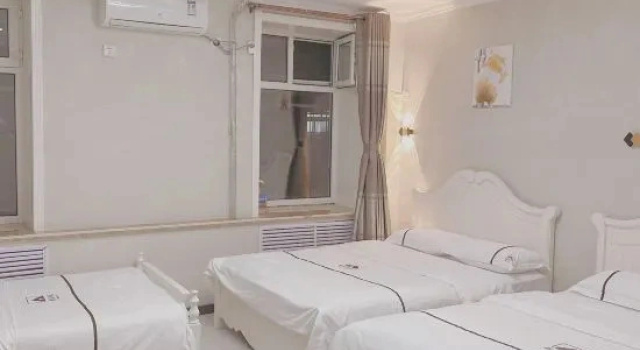 Łóżko w pokoju wieloosobowym Huayi Hostel