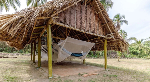Кровать в общем номере CASA DE CAMPO CASTILLETE dentro del PARQUE TAYRONA