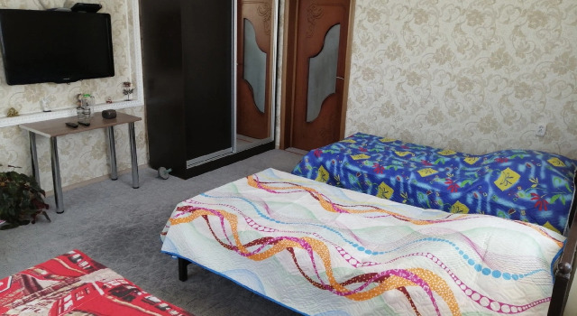 Кровать в общем номере Гостевой Дом Сибай