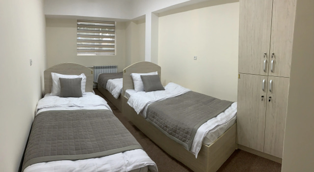 Кровать в общем номере Paradise inn
